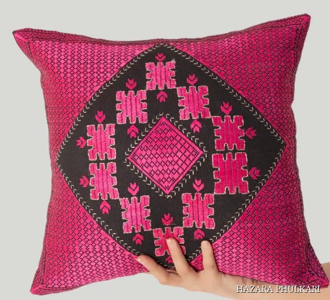 Magenta Phulkari cushion cover with a large central black diamond panel filled with fine pink counted-thread motifs