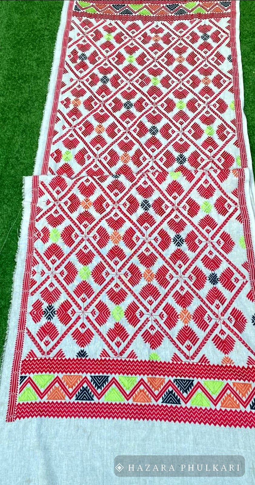 Jasti Phulkari shawl embroidered in red on natural handwoven fabric with a triangular border