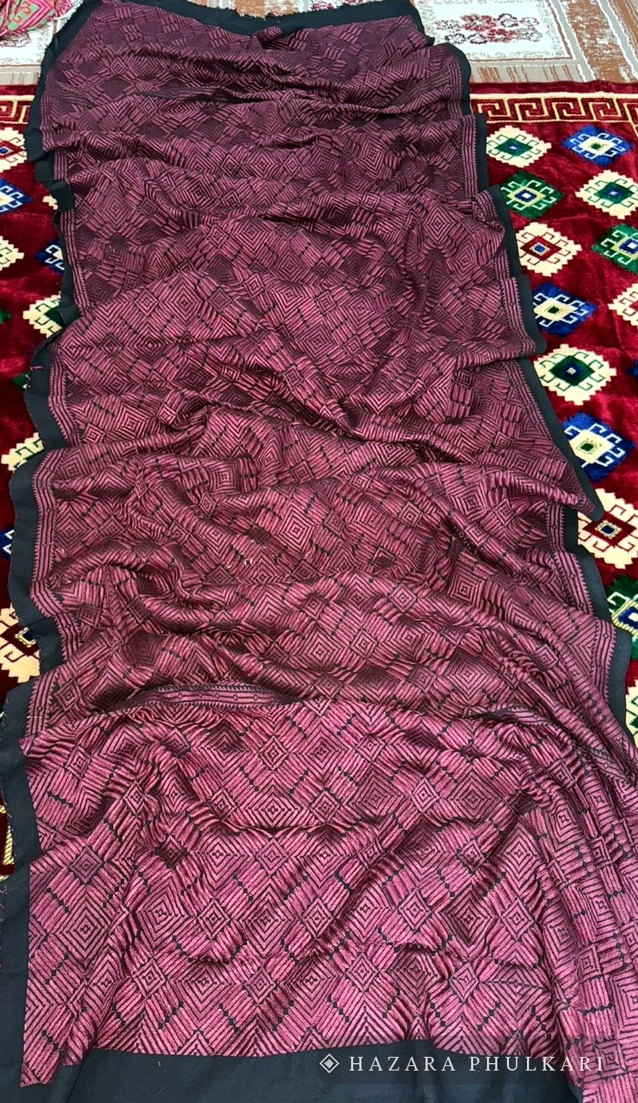 Rose and maroon Phulkari shawl with all-over geometric embroidery and a black border